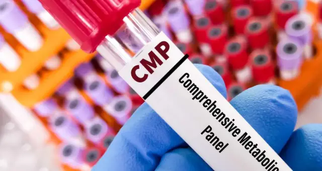 Blood sample tube held in a gloved hand