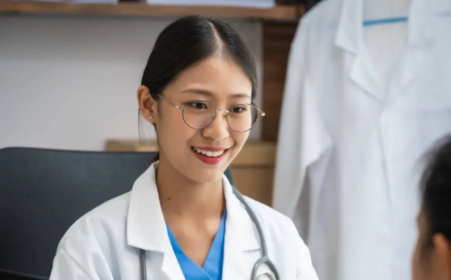 Doctor talking with a patient across a desk
